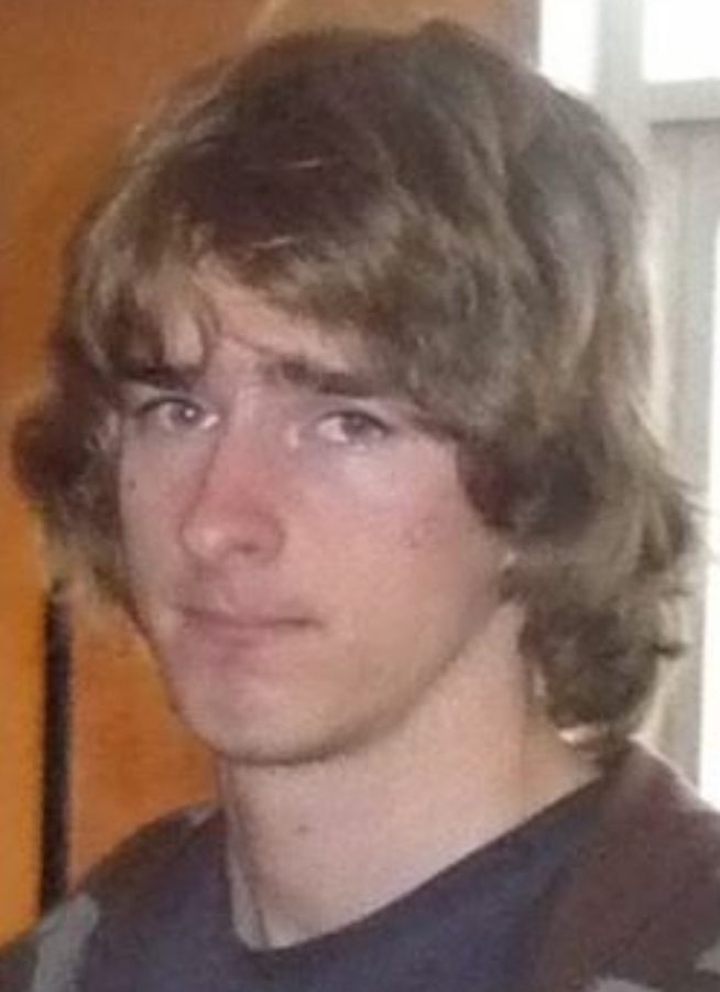 A young Jye with long hair